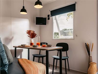 Living room with sofa and table in a 5-star IRM cottage