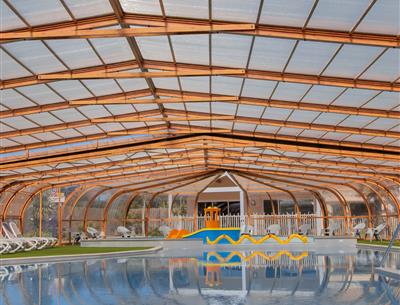 Indoor heated swimming pool at Yelloh! Village La Pomme de Pin campsite